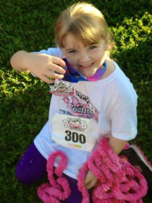 EBC PIC LITTLE GIRL WITH MEDAL